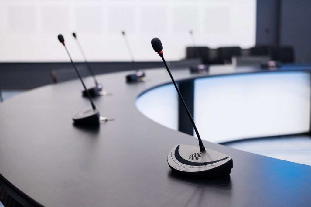 image of microphones monitoring public policy is important for local governments